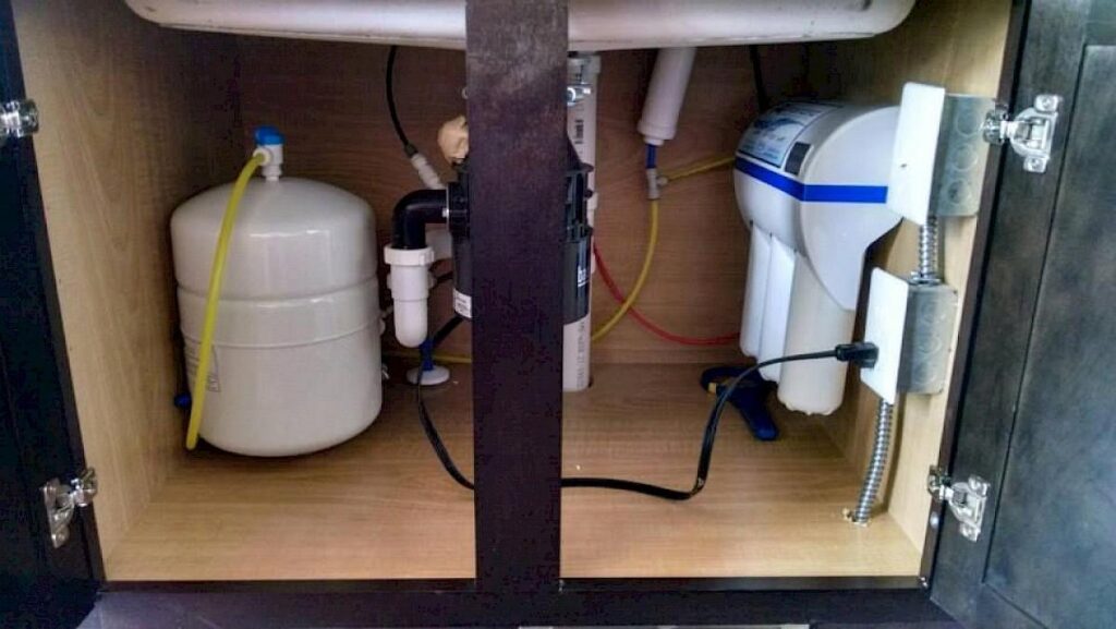 Installing an UltroWater reverse osmosis unit under the sink in South Lyon, MI.